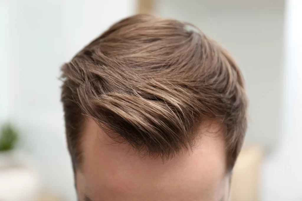 close up of man s light brown stylish hair utc