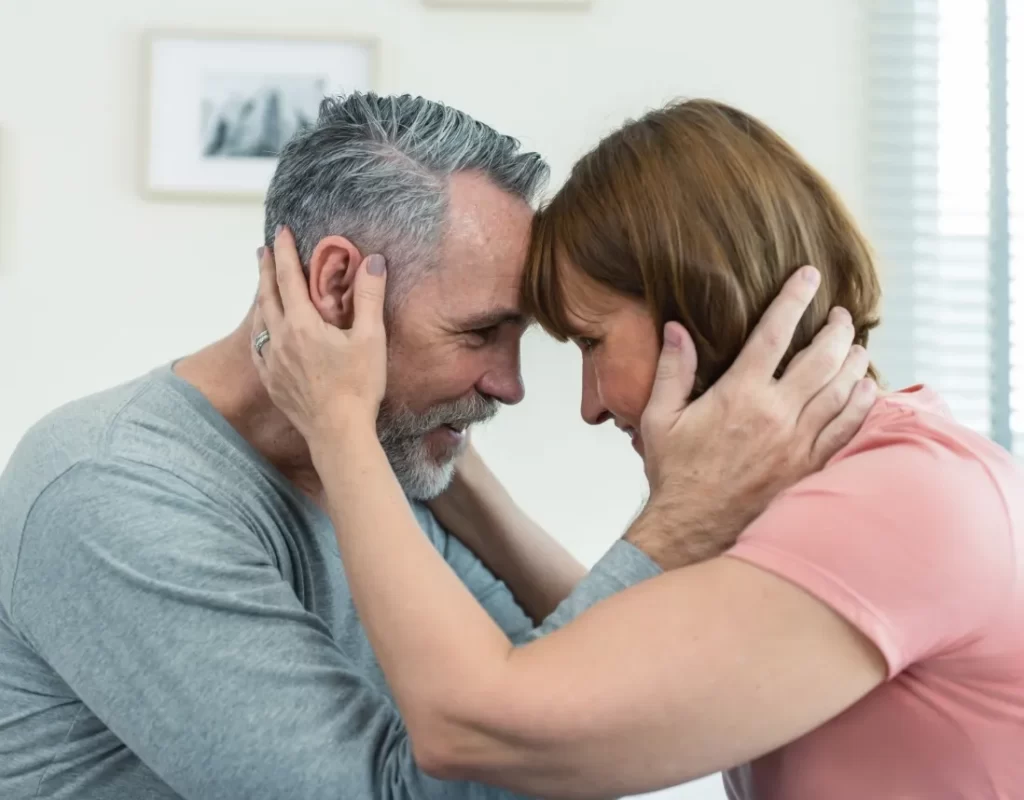 caucasian senior older couple sitting on bed then utc